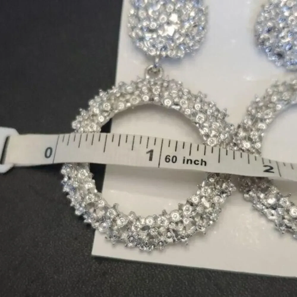 Silver tone circular themed statement earrings texture chunky